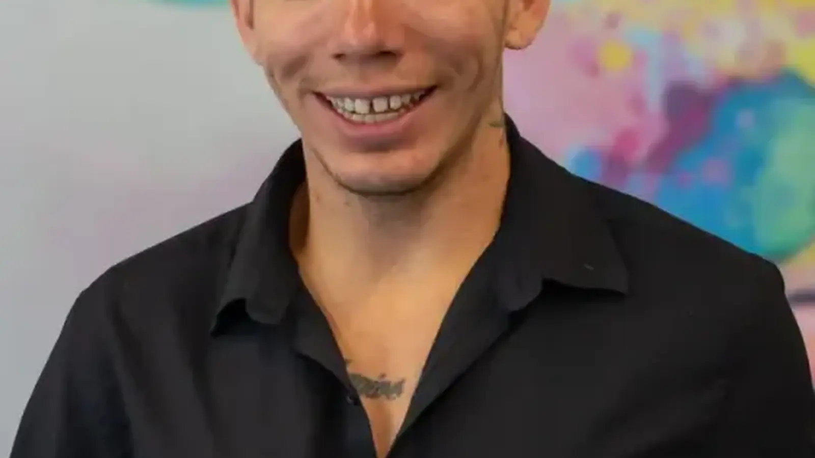 A stylist holding professional haircare products