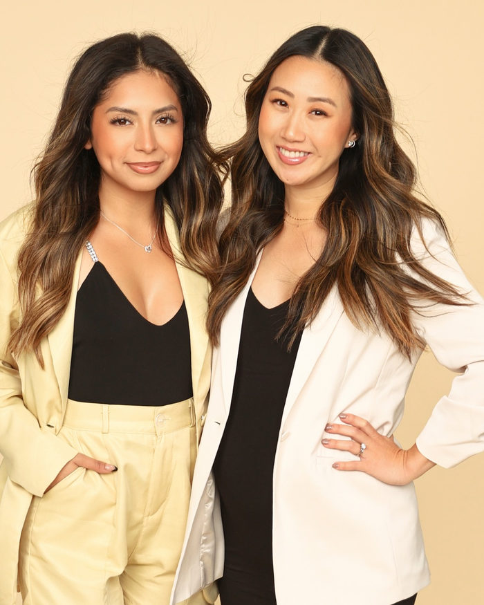 Two stylists from the Vanity The Salon team